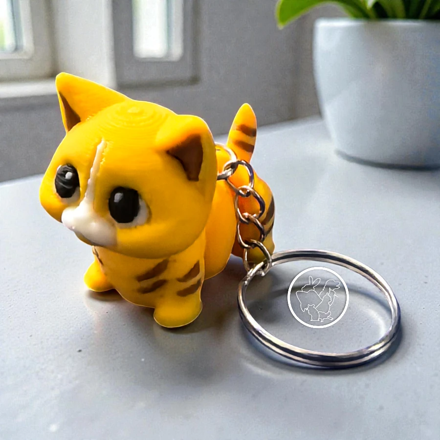 Llavero 3D de gato articulado naranja con cafe