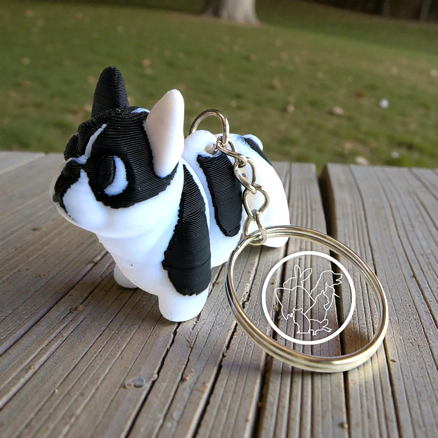 Llavero 3D de bulldog frances articulado blanco mnchas negras