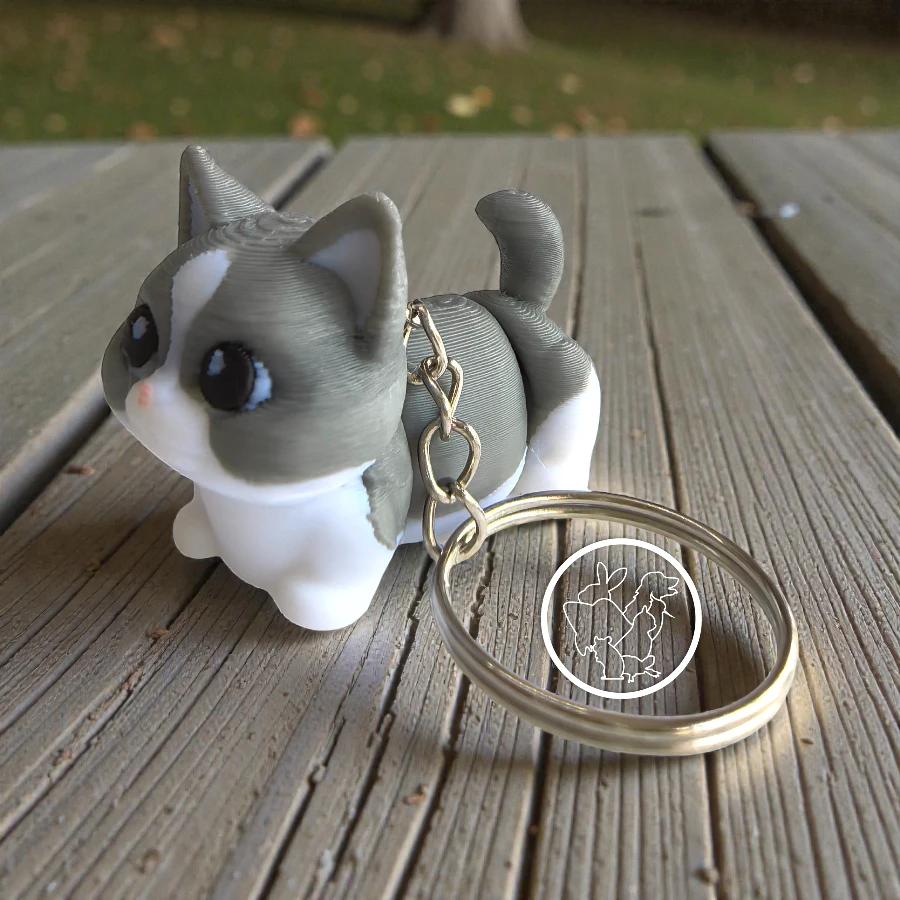 Llavero 3D de gato articulado blanco con gris