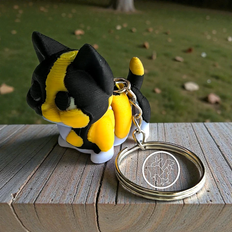 Llavero 3D de gato articulado manchado amarillo